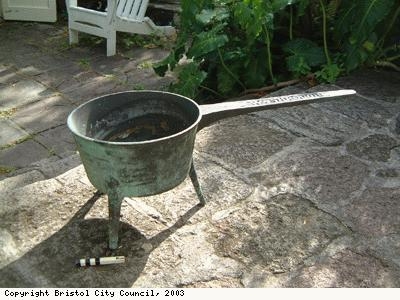 A brass skillet or saucepan
